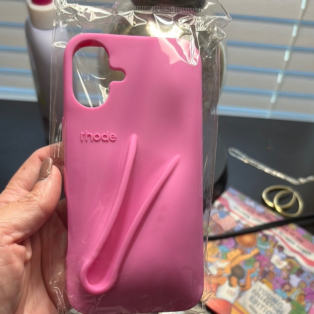 Rhode Pink iPhone 16 plus with matching lipgloss.